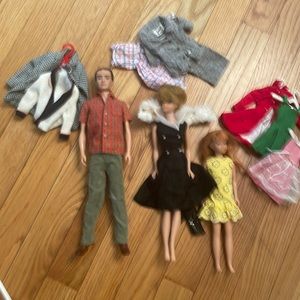 Ken, Barbie and Skipper with outfits and a Skipper carrying case